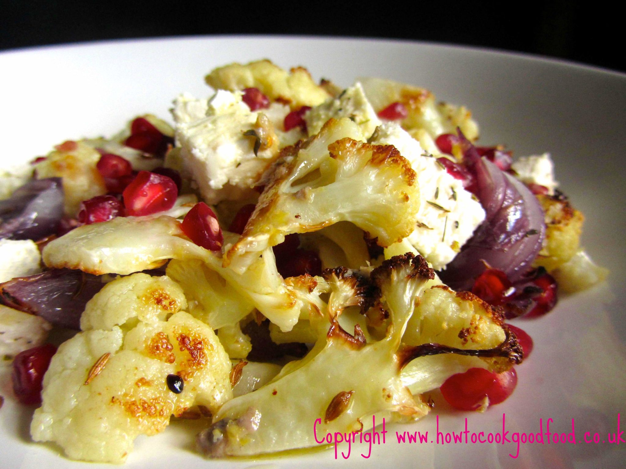 Roasted cauliflower and pomegranate salad with a lemon anchovy dressing